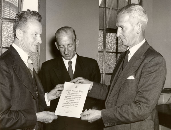 Photograph of presentation to Hugh Samuel King on retirement from Southall Gas Works in 1957